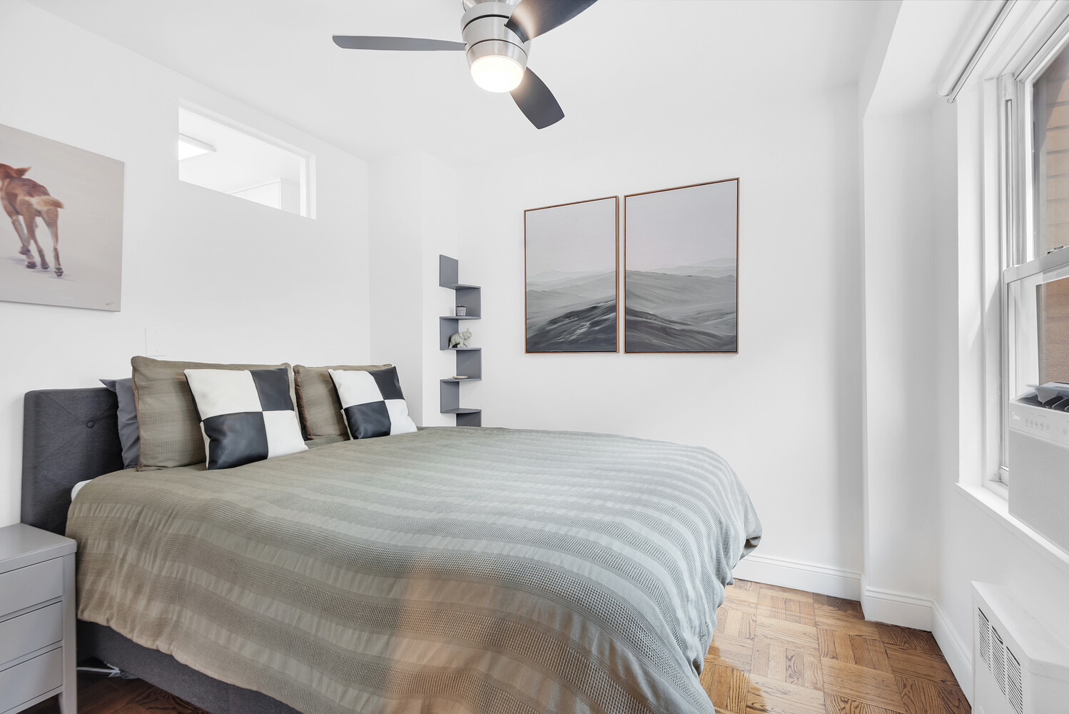 310 Lexington Avenue, Unit 9G Manhattan, NY 10016 - Photo 4 of 6 a bedroom with a bed and a window