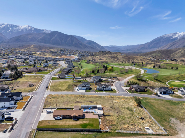 296 West Olympic Lane, Unit 2 Elk Ridge, UT 84651 - Photo 13 of 14 Aerial view of residential area with a golf club and a water and mountain view