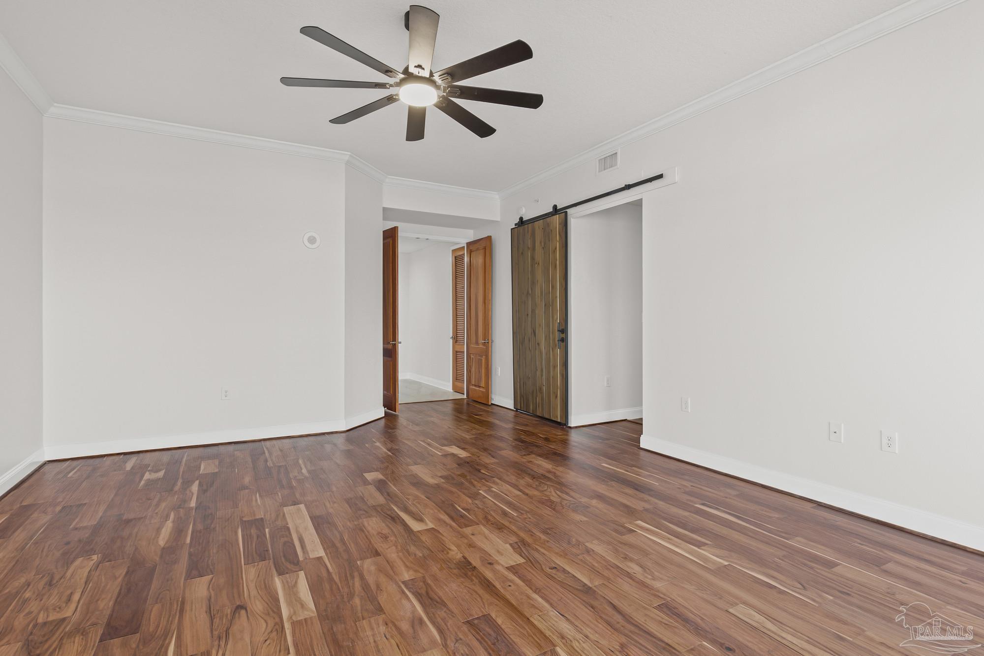 14900 River Road, Unit 904 Perdido Key, FL 32507 - Photo 24 of 62 a view of an empty room with wooden floor