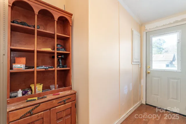 a view of walk in closet with empty racks