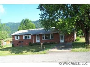60 Osborne Farm Road Canton, NC 28716 - Photo 1 of 12 a front view of a house with garden