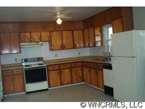 60 Osborne Farm Road Canton, NC 28716 - Photo 4 of 12 a kitchen with stainless steel appliances granite countertop a stove a sink and a refrigerator