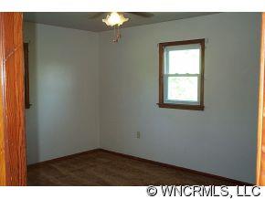 60 Osborne Farm Road Canton, NC 28716 - Photo 6 of 12 an empty room with a window