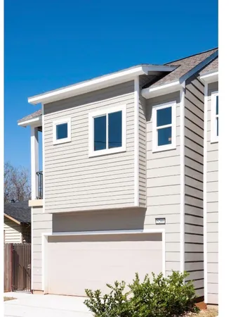 a view of an empty walk in closet with wooden floor
