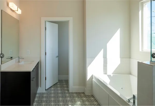 a bathroom with a bathtub and a sink