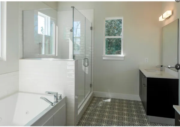 a bathroom with a bathtub and window