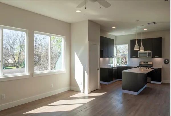 a view of a hallway view with wooden floor and staircase