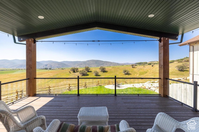 6117 North Rocky Ridge Road Peoa, UT 84061 - Photo 23 of 83 Deck with a mountain view and a rural view