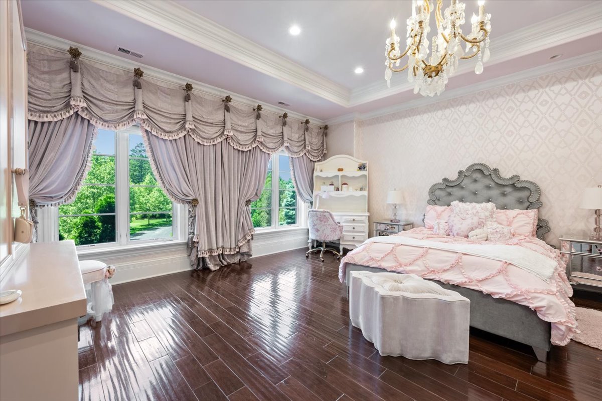 319 Sheridan Road Winnetka, IL 60093 - Photo 41 of 81 a room with chandelier fan and wooden floor