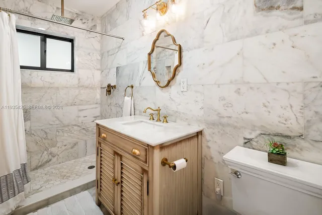 a bathroom with a sink a vanity and a mirror