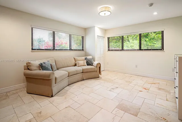 a living room with furniture and a window