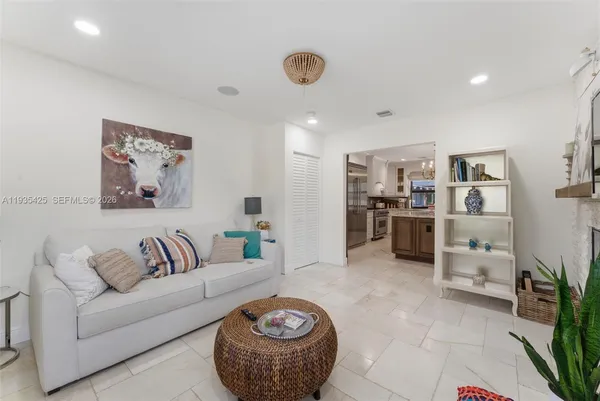 a living room with furniture and a rug