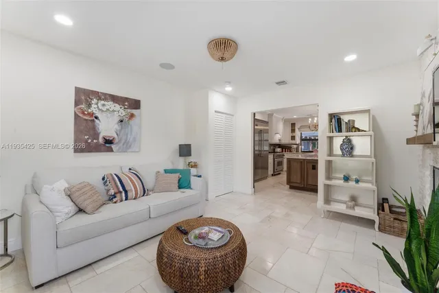 a living room with furniture and a rug
