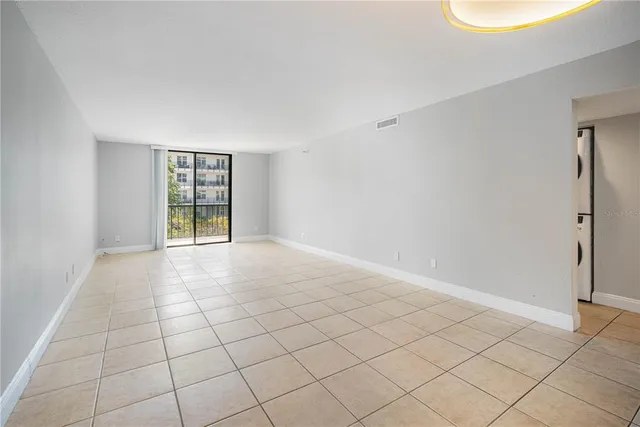 a bathroom with a bathtub shower sink mirror vanity and toilet