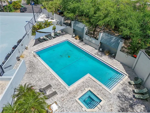 an outdoor sitting area with a garden and fire pit