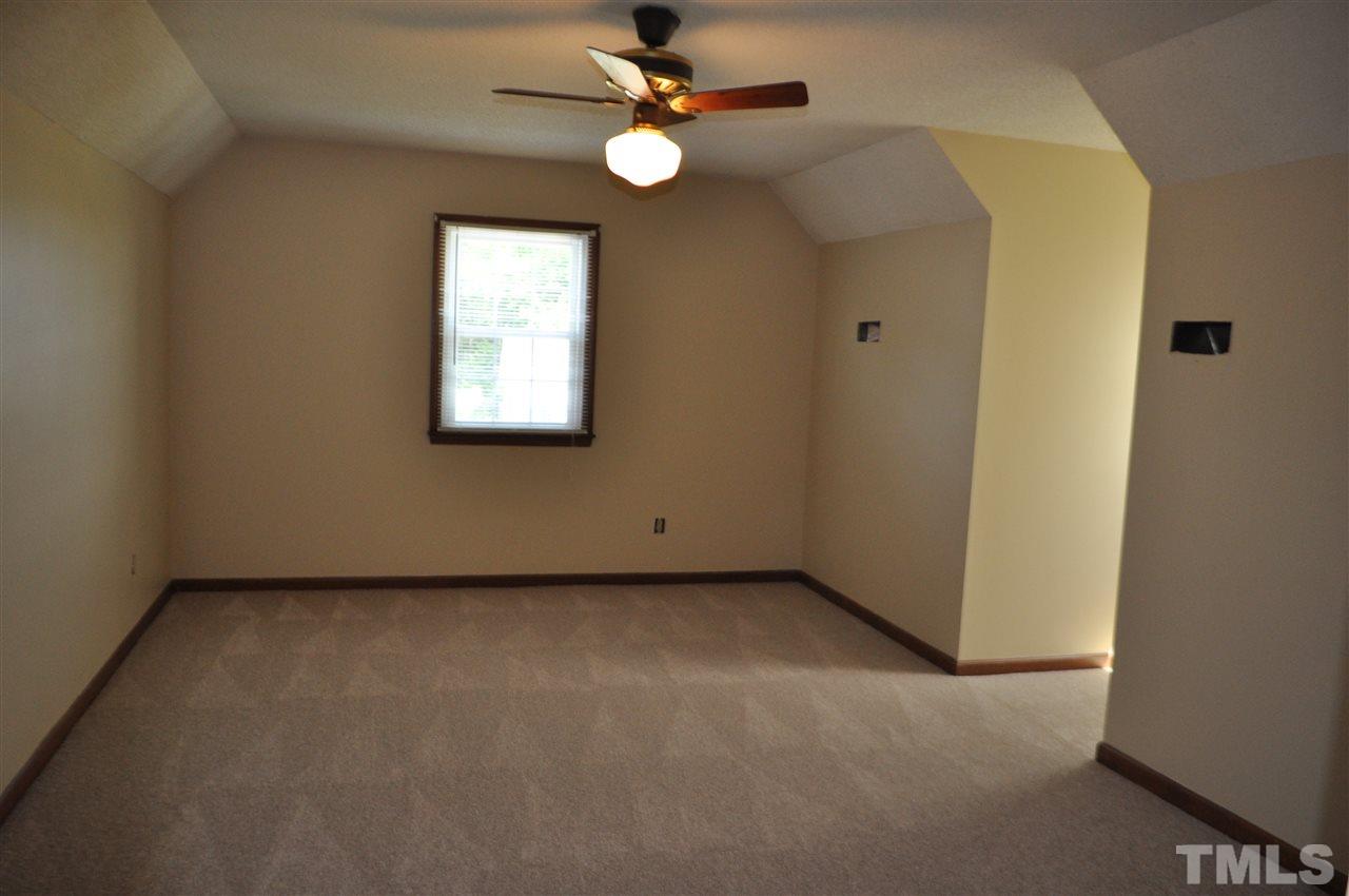 5616 Cleveland Road Clayton, NC 27520 - Photo 13 of 21 Large upstairs bedroom with dormer windows
