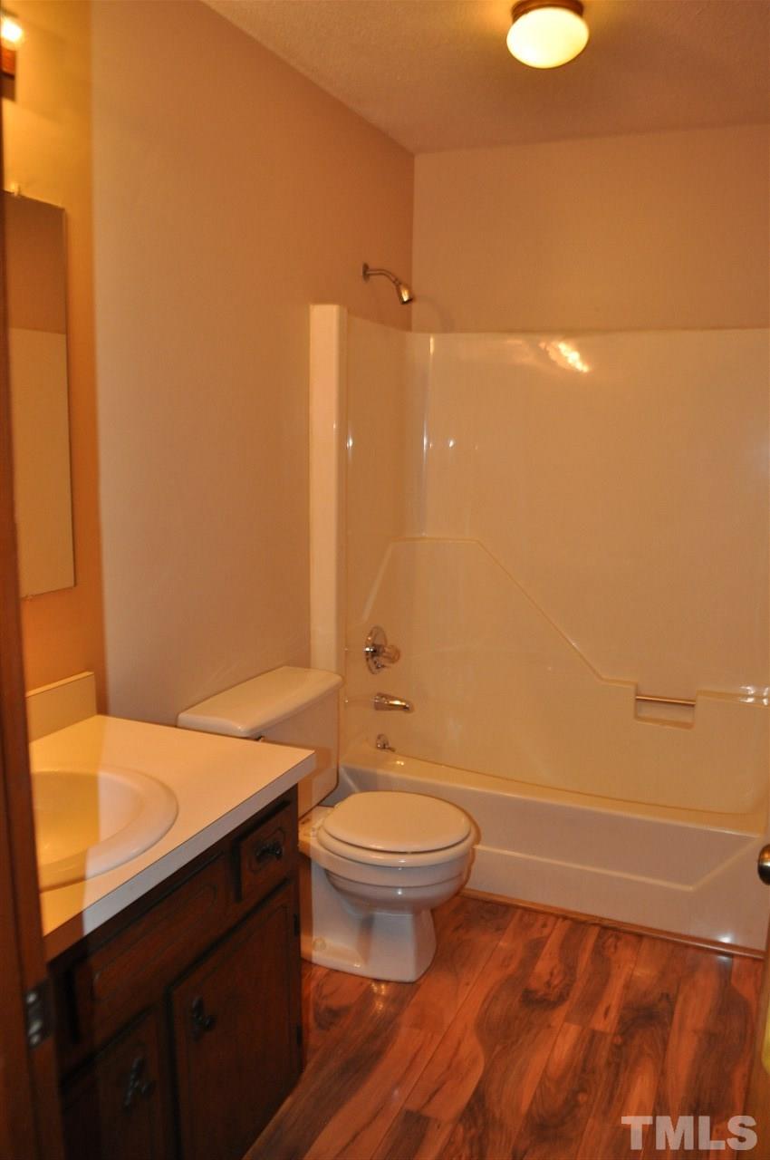 5616 Cleveland Road Clayton, NC 27520 - Photo 14 of 21 Upstairs bathroom has new laminate floors