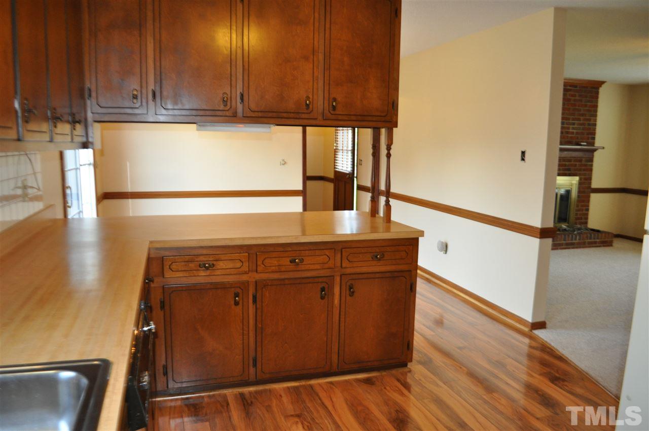5616 Cleveland Road Clayton, NC 27520 - Photo 5 of 21 Lots of counter space. New laminate wood floor thru out kitchen, dining and laundry room.