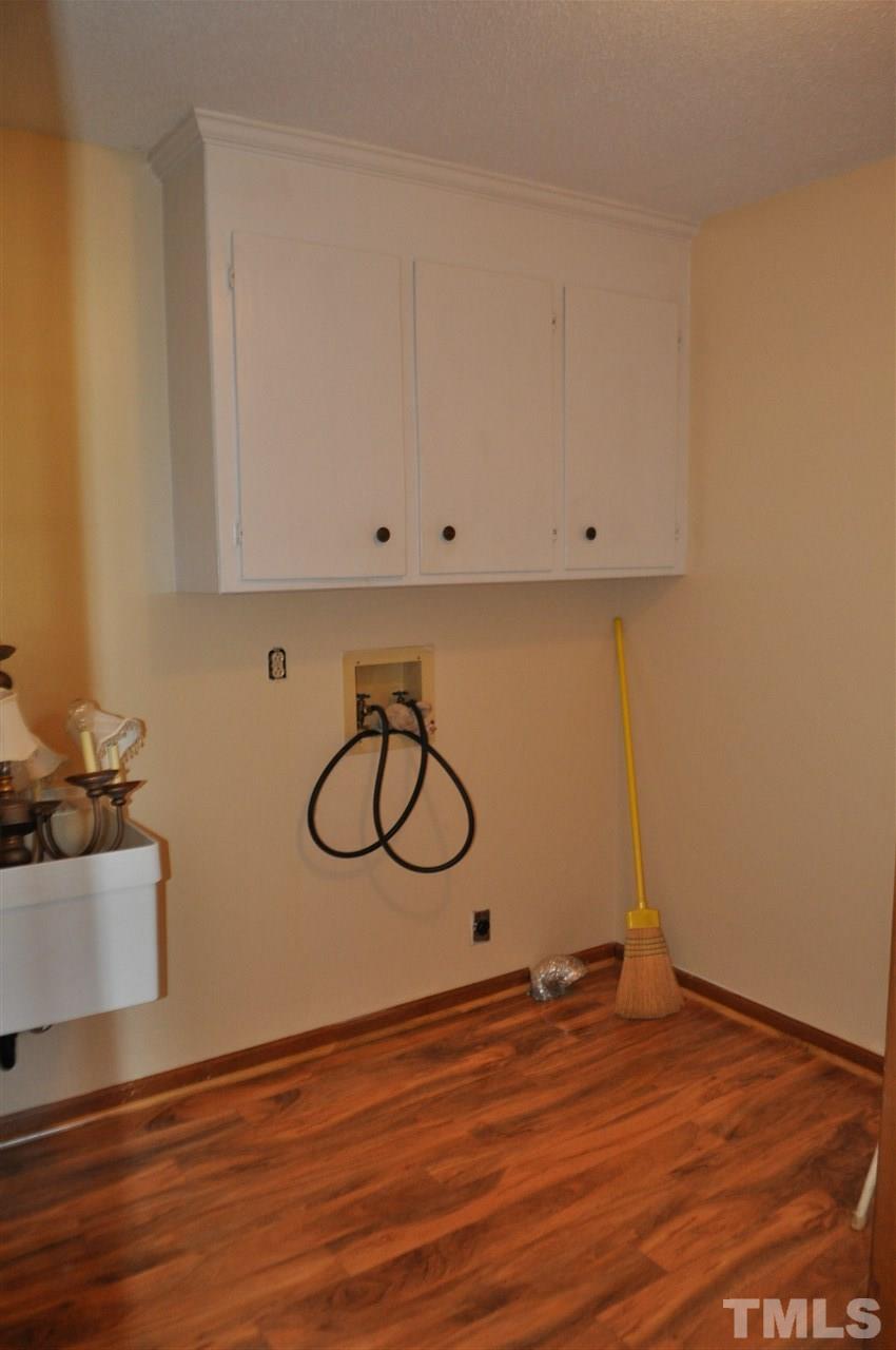 5616 Cleveland Road Clayton, NC 27520 - Photo 8 of 21 Large laundry room with utility sink