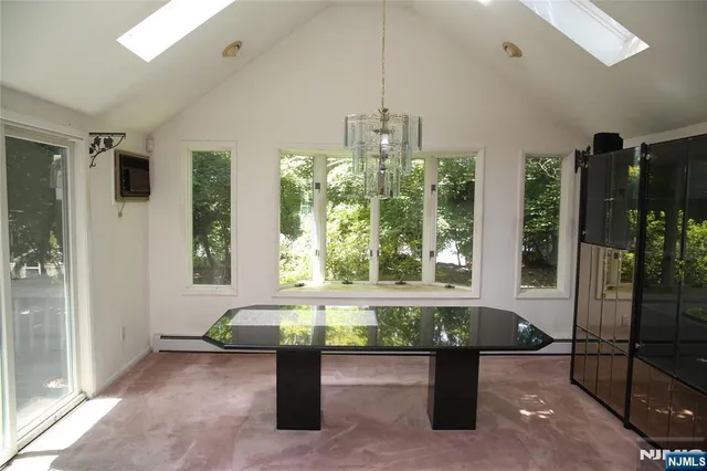 a dining room with furniture and window