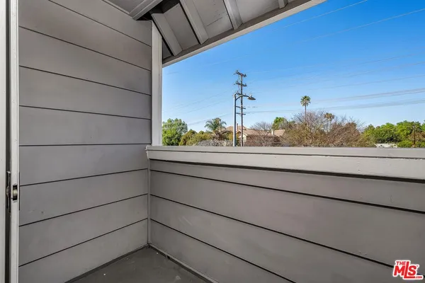 a view of a window and a wooden fence