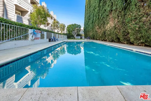 a view of swimming pool from a balcony