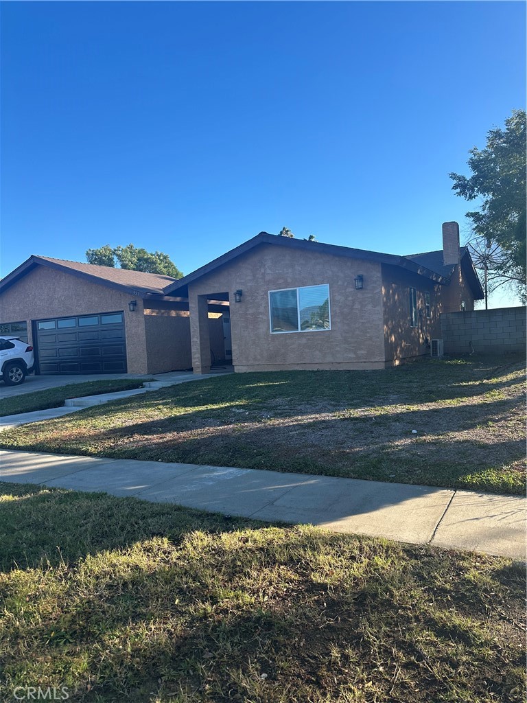 943 West Valencia Street Rialto, CA 92376 - Photo 18 of 18 a view of a house with a yard
