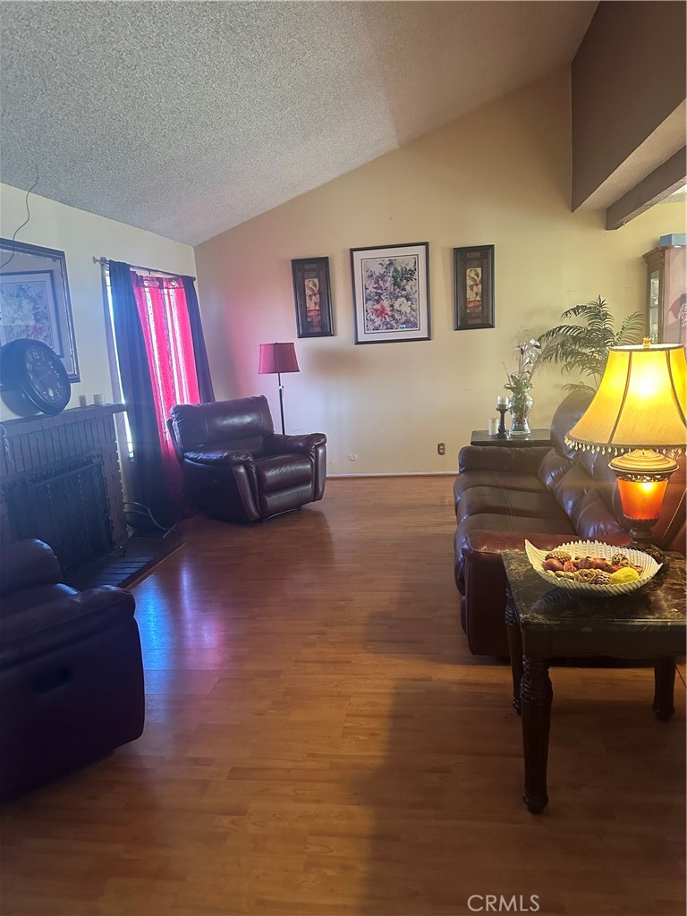 943 West Valencia Street Rialto, CA 92376 - Photo 2 of 18 a living room with furniture and a lamp