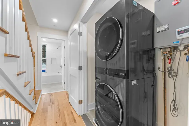 a view of a hallway with washer and dryer