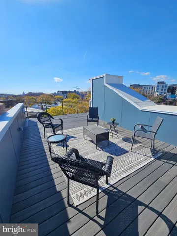 a view of a terrace with seating area