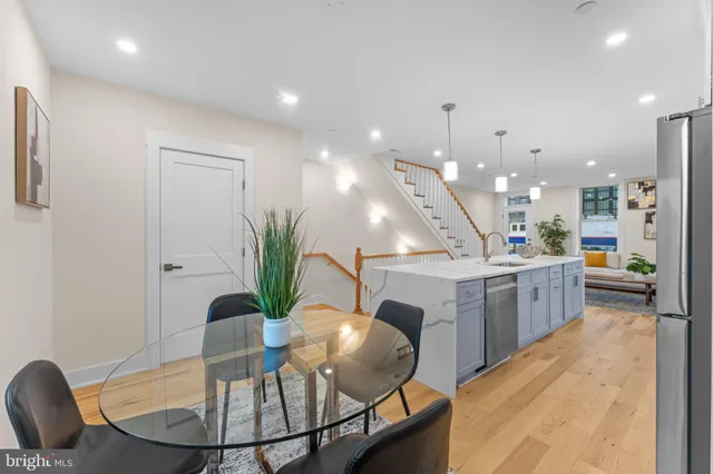 a kitchen with a table and chairs in it