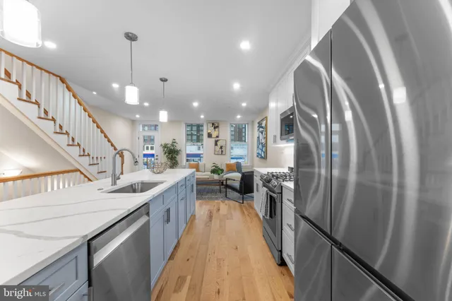 a kitchen with stainless steel appliances granite countertop lots of counter top space