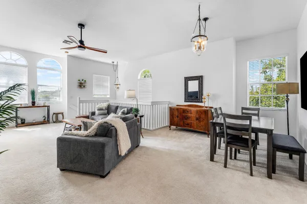 a bedroom with a bed and painting on the wall