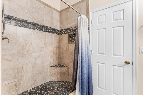 an aerial view of a house with a swimming pool