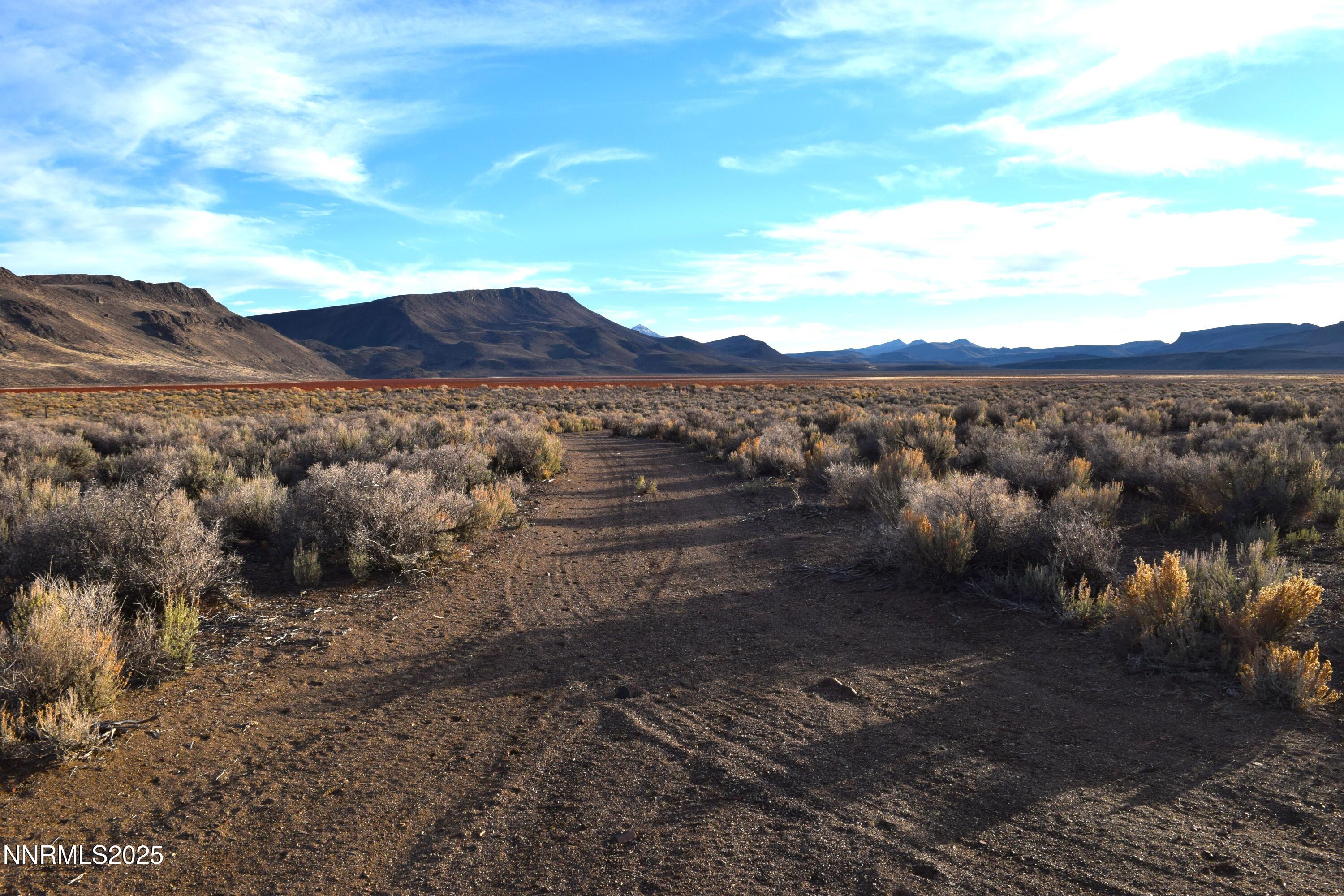 3307-3308 High Rock Road Reno, NV 89510 - Photo 19 of 39 a view of a lake with mountains in the background