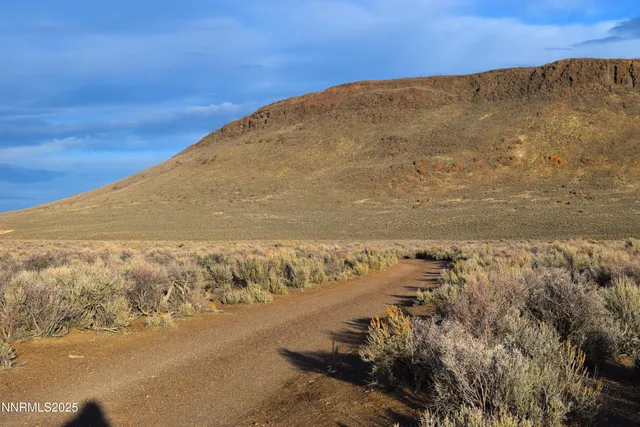 a view of mountain with sunset view