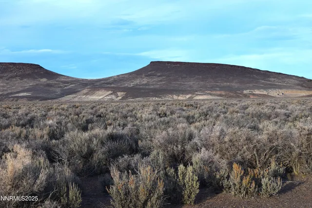 a view of a lake with mountains in the background