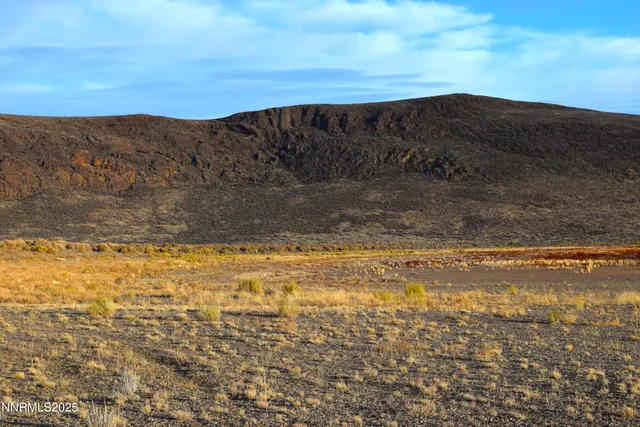 a view of mountains and valleys