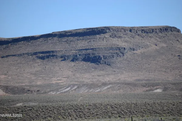 a view of mountains and valleys