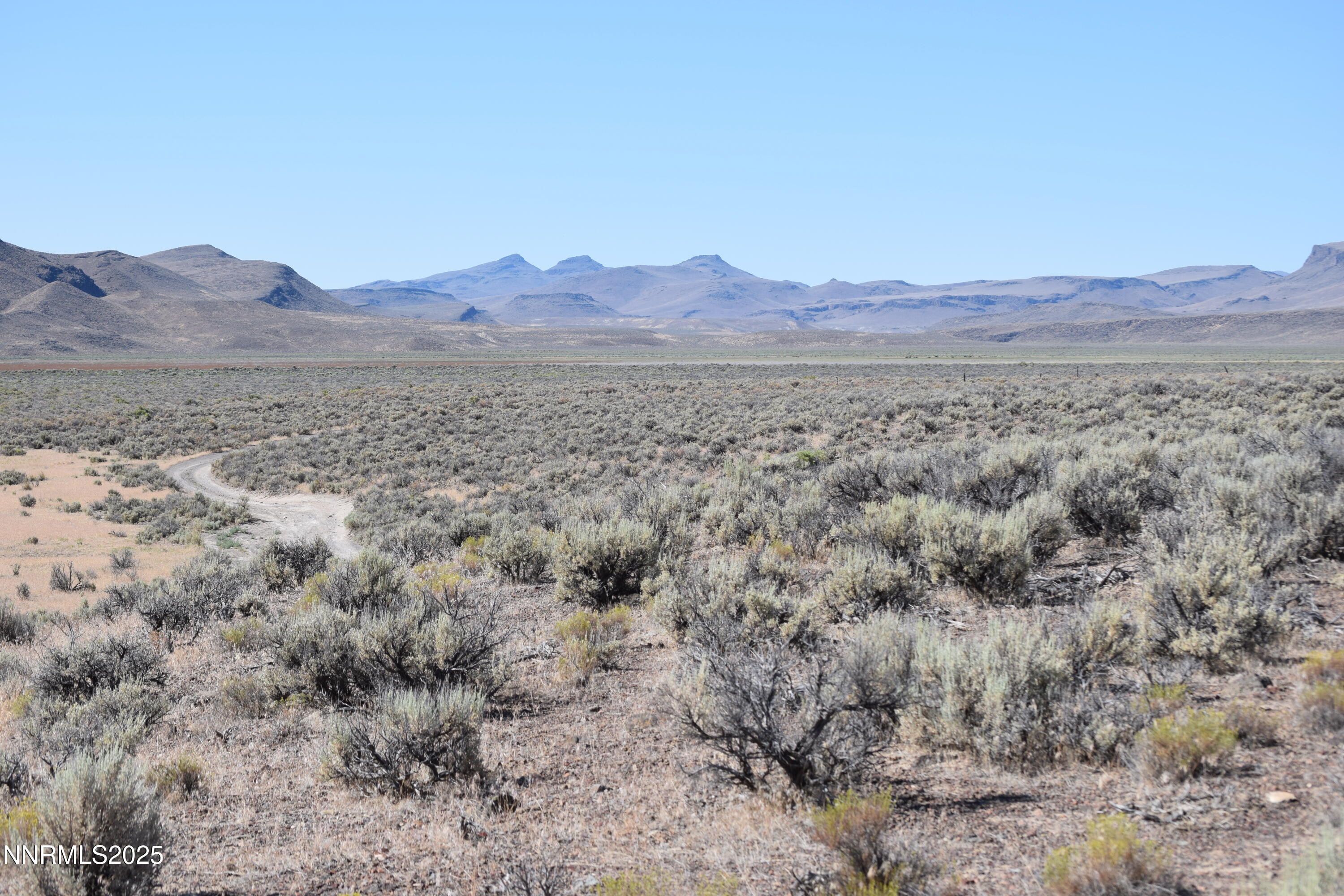 3307-3308 High Rock Road Reno, NV 89510 - Photo 36 of 39 a view of a large mountain with a mountain in the background