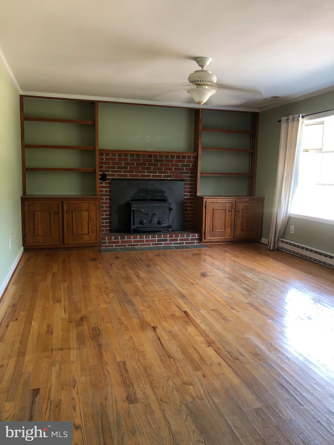 8497 Ingleton Road Easton, MD 21601 - Photo 4 of 29 Living Room with Wood Stove