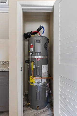 a room with a stove and a mirror