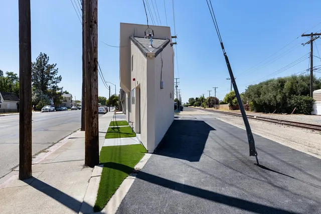 a view of a balcony with yard