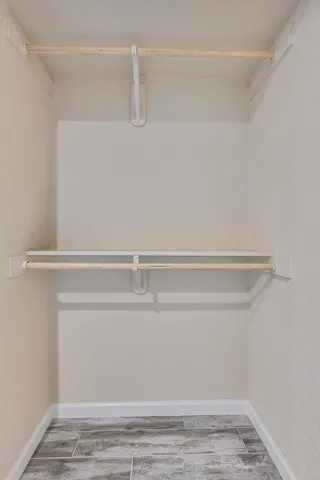 a view of an empty walk in closet