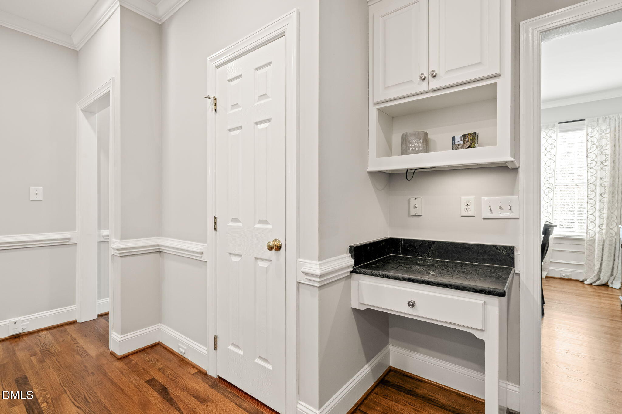 5504 Orchid Hill Drive Raleigh, NC 27613 - Photo 11 of 46 a kitchen with white cabinets and sink
