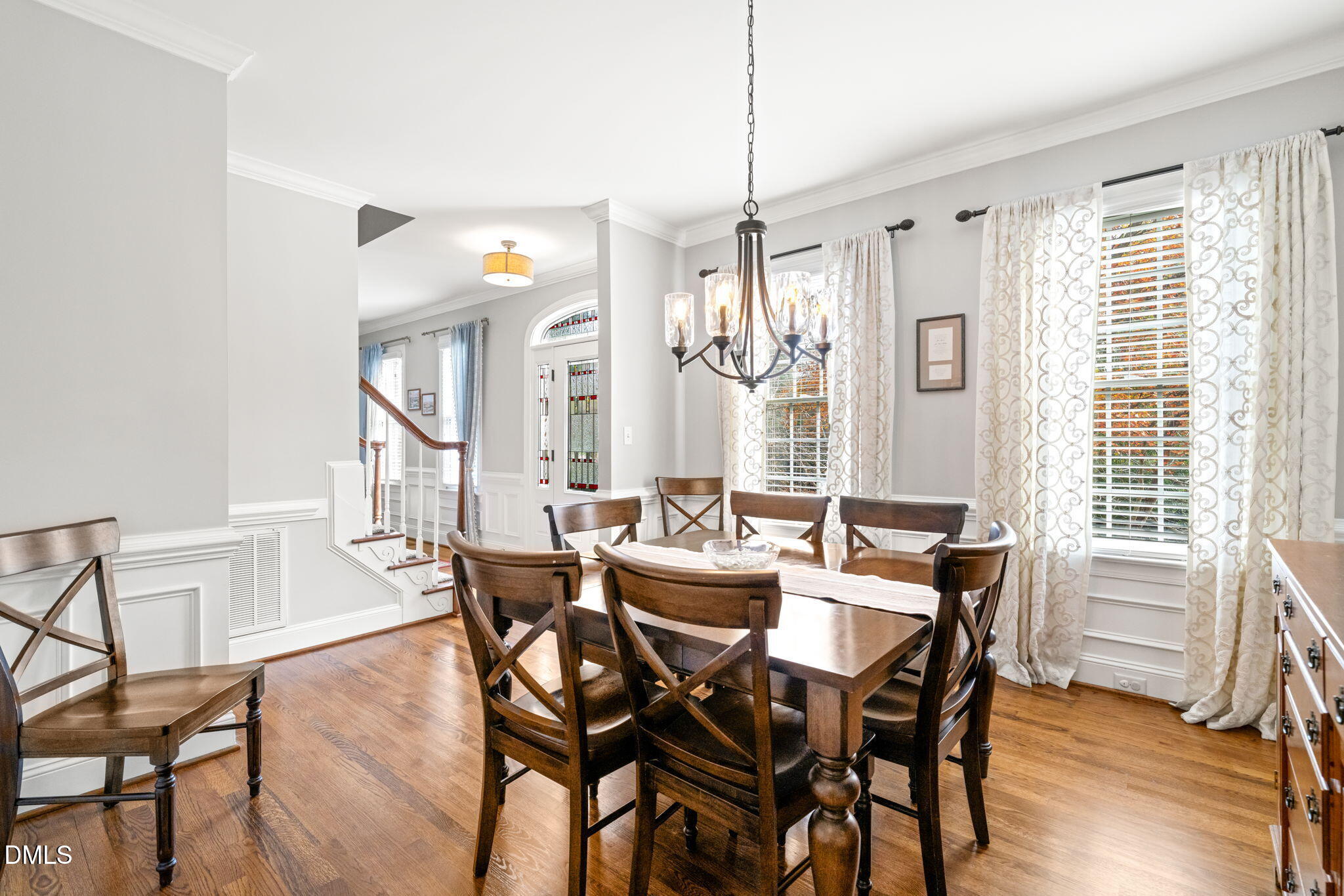 5504 Orchid Hill Drive Raleigh, NC 27613 - Photo 12 of 46 a view of a dining room with furniture window and wooden floor