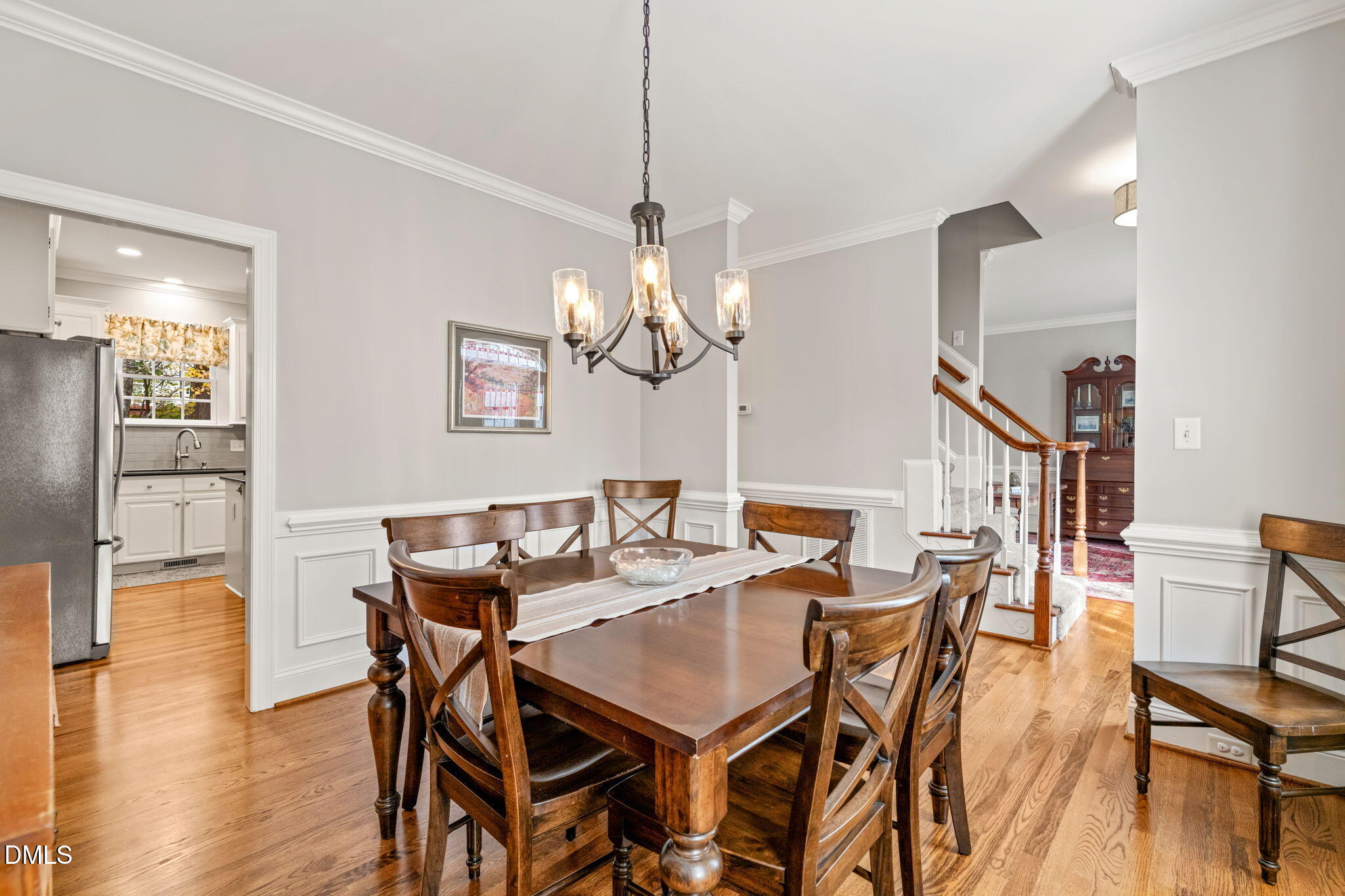 5504 Orchid Hill Drive Raleigh, NC 27613 - Photo 13 of 46 a view of a dining room with furniture and wooden floor