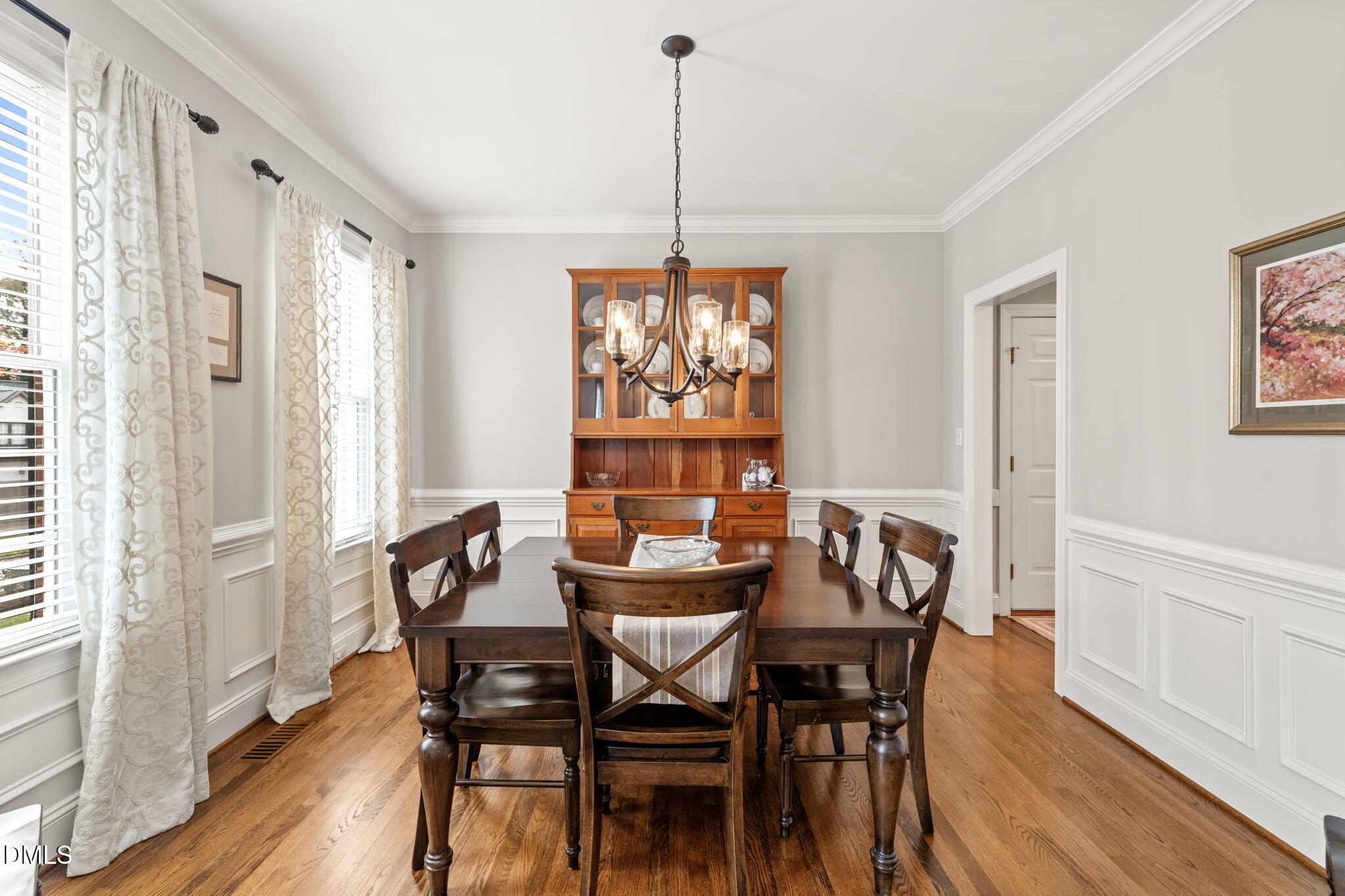 5504 Orchid Hill Drive Raleigh, NC 27613 - Photo 14 of 46 a view of a dining room with furniture window and wooden floor