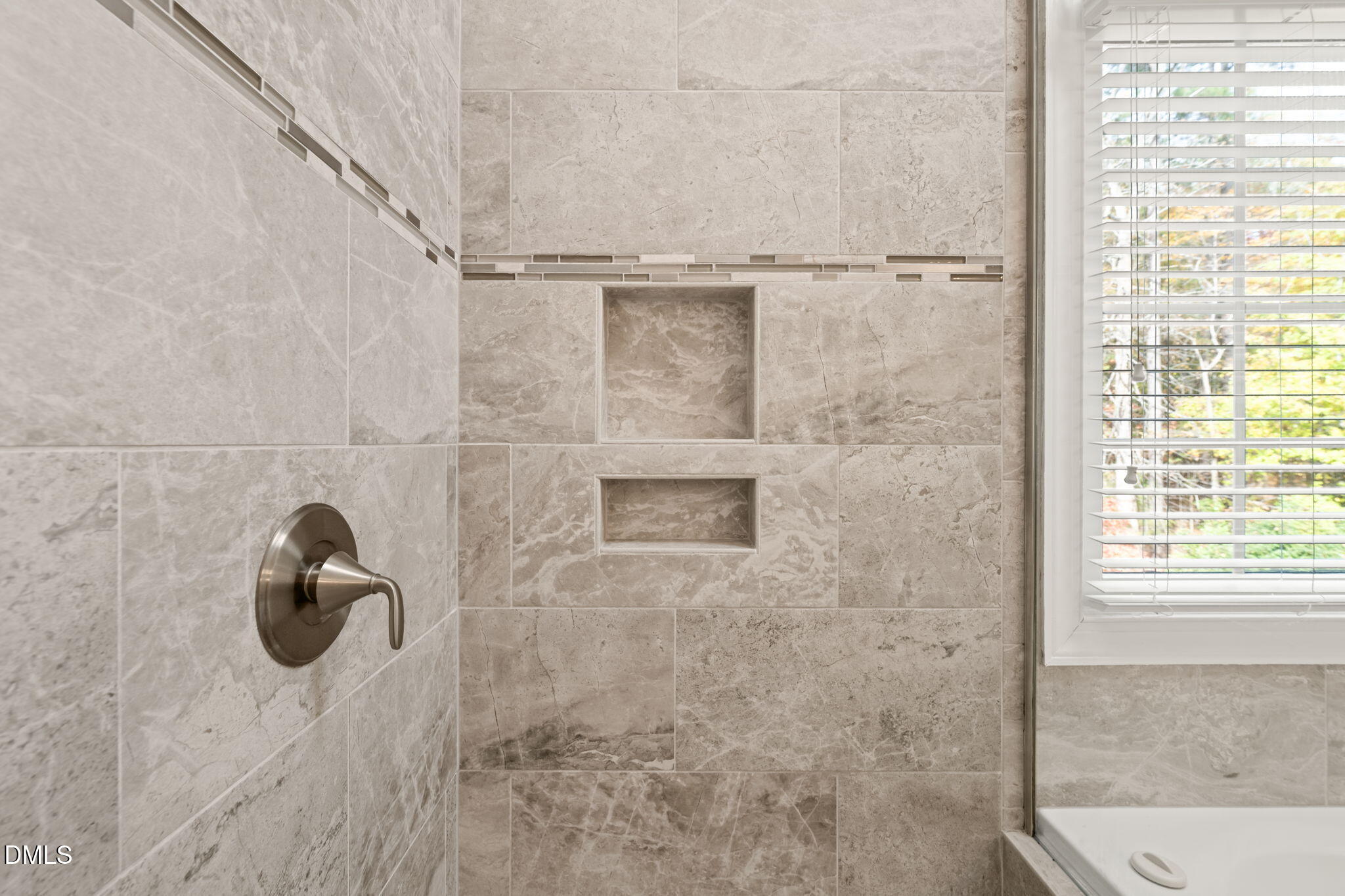 5504 Orchid Hill Drive Raleigh, NC 27613 - Photo 22 of 46 a bathroom with a shower