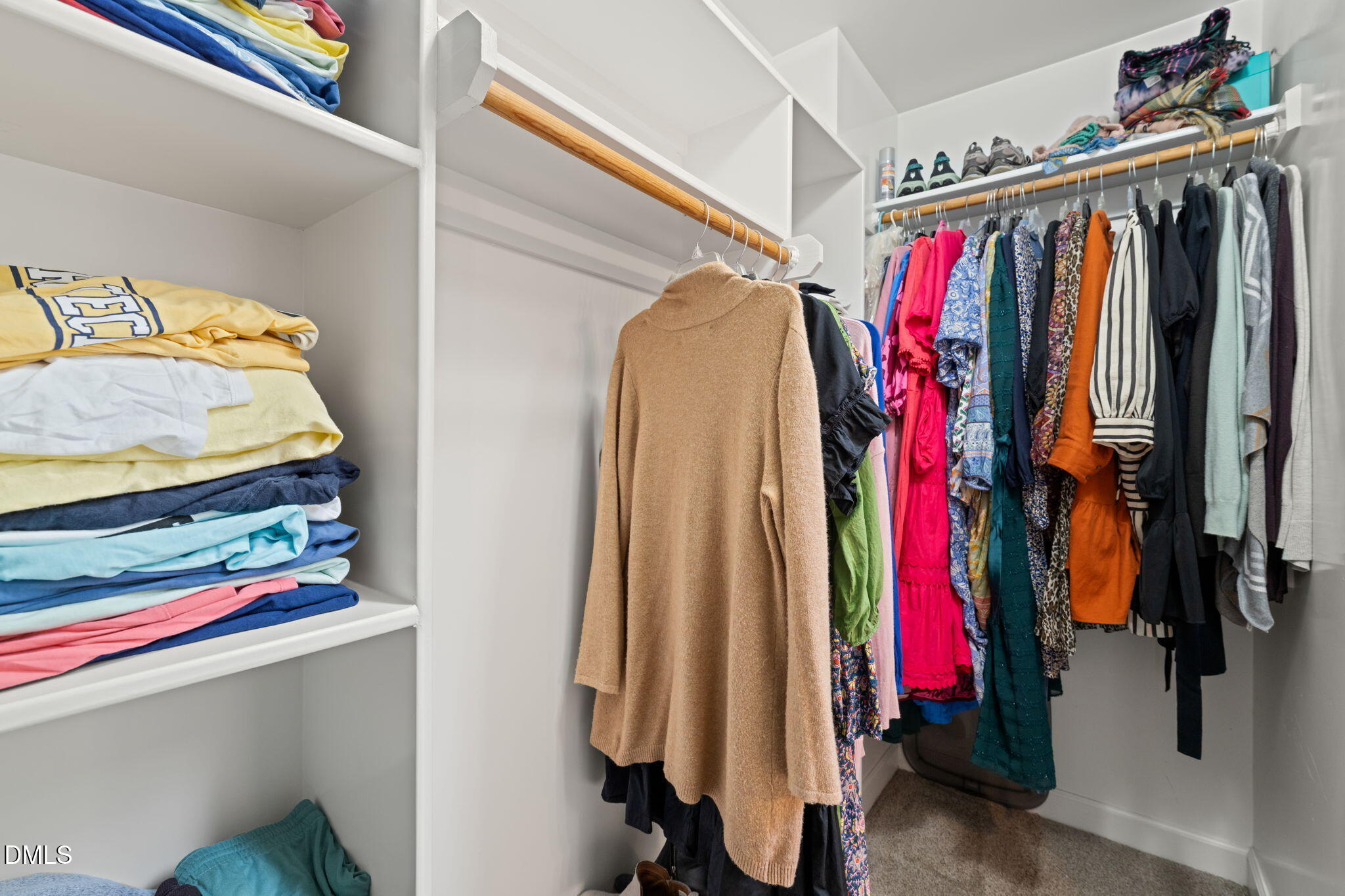 5504 Orchid Hill Drive Raleigh, NC 27613 - Photo 23 of 46 a view of walk in closet with clothes and shoes